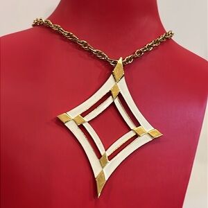 Vintage Trifari White Enamel & Golden 24” Necklace. Excellent condition.